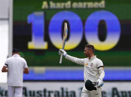 Australia's captain Michael Clarke celebrates his century during the second day of the second Ashes test cricket match against England at the Adelaide Oval December 6, 2013.