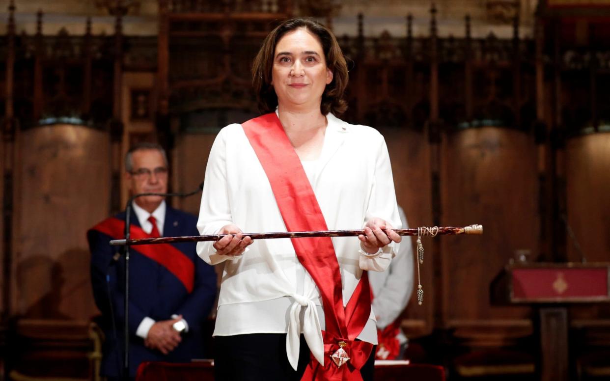  Ada Colau poses during her swearing-in ceremony as the new mayor of Barcelona  - REUTERS