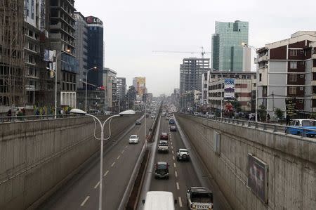 Vehicles drive out of an underpass in Ethiopia's capital Addis Ababa, in this May 26, 2014 file photo. REUTERS/Tiksa Negeri/Files