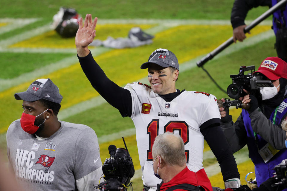 Tom Brady #12 of the Tampa Bay Buccaneers celebrates their 31-26 win over the Green Bay Packers during the NFC Championship game at Lambeau Field on January 24, 2021, in Green Bay, Wisconsin. / Credit: Getty Images