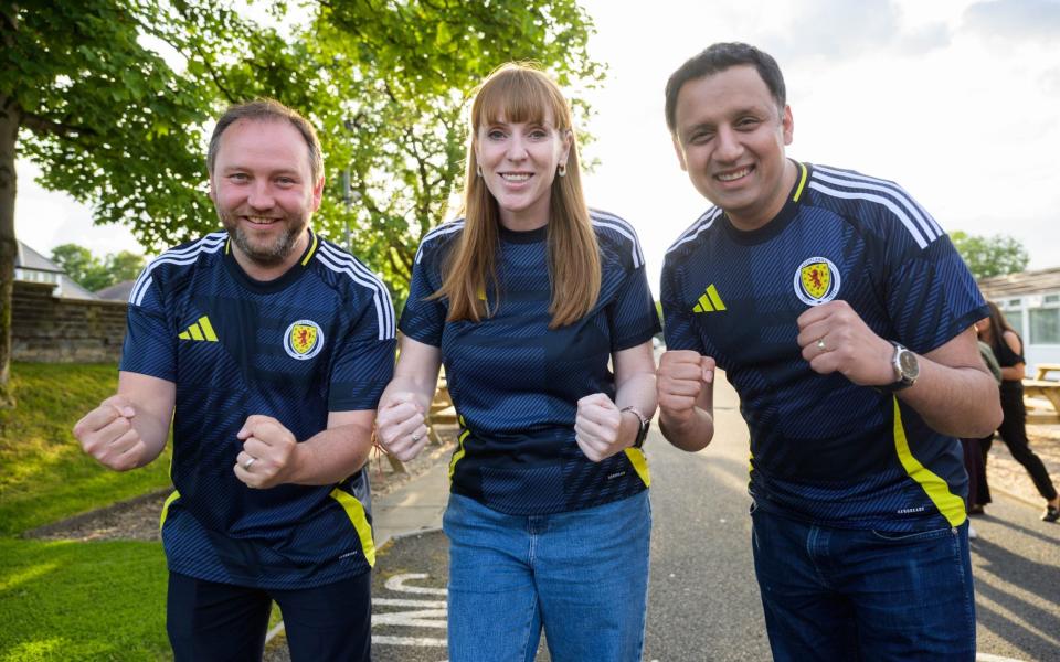 Labour deputy leader Angela Rayner (middle) and Scottish leader Anas Sarwar watch Scotland's first game of the Euros together ahead of a campaign event today