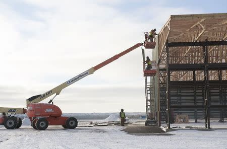 Construction on a Menards hardware store continues despite temperatures in the single digits in Williston, North Dakota November 12, 2014. REUTERS/Andrew Cullen