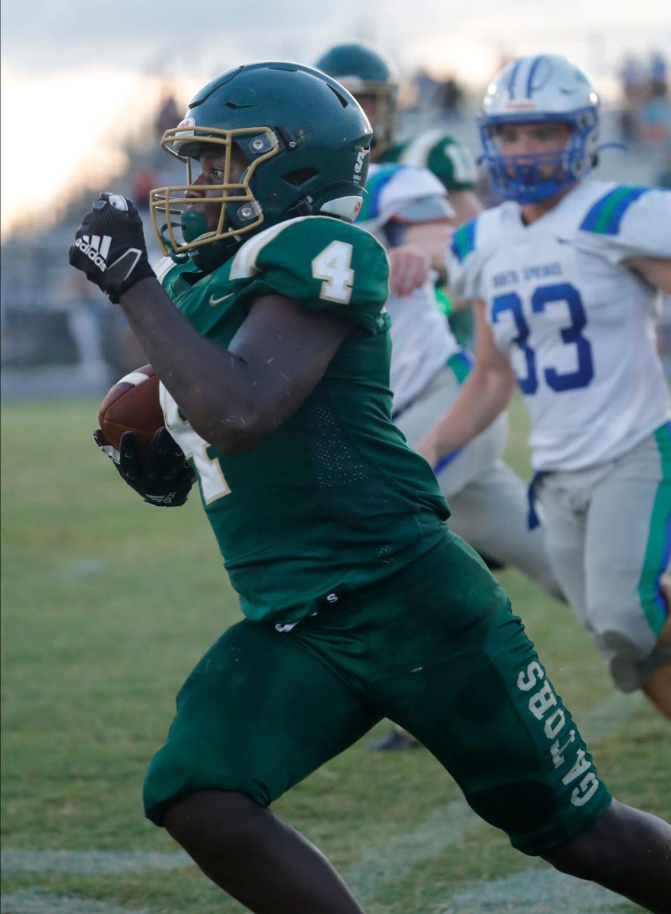 Gervaris Leaphart of Island Coast looks for an opening while rushing against Bonita. The Island Coast Gators hosted Bonita Springs for their opening game matchup Friday, August 26, 2022.