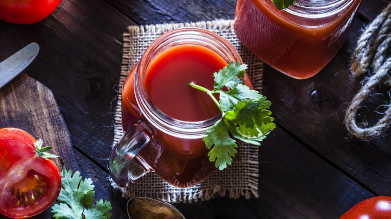 tomatoes and juice on table