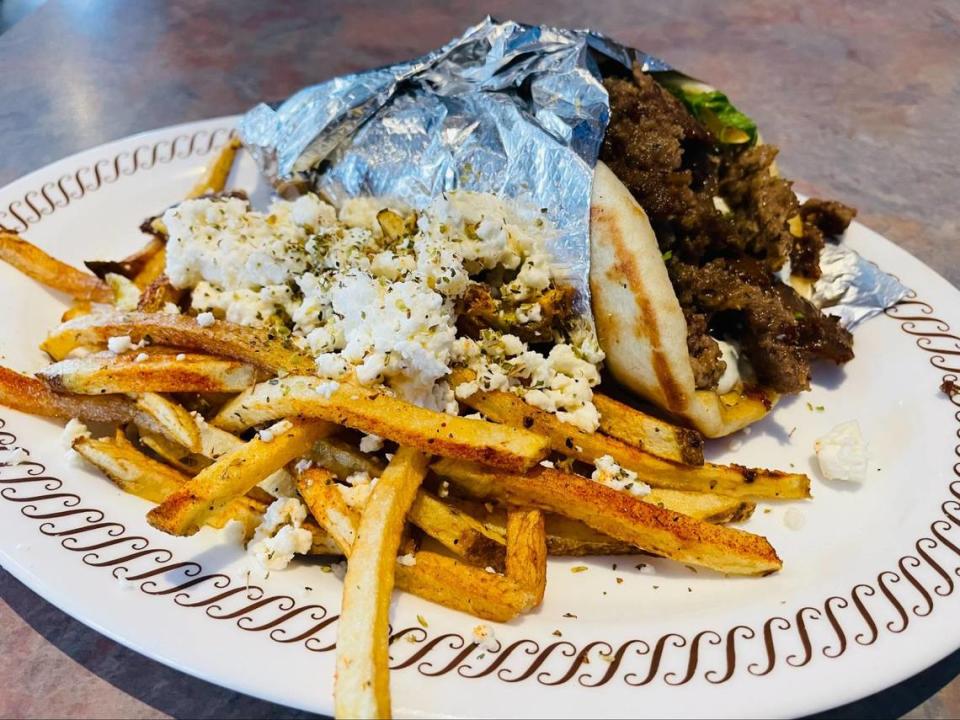 Order a gyro and feta fries from The Mad Greek of Charlotte.