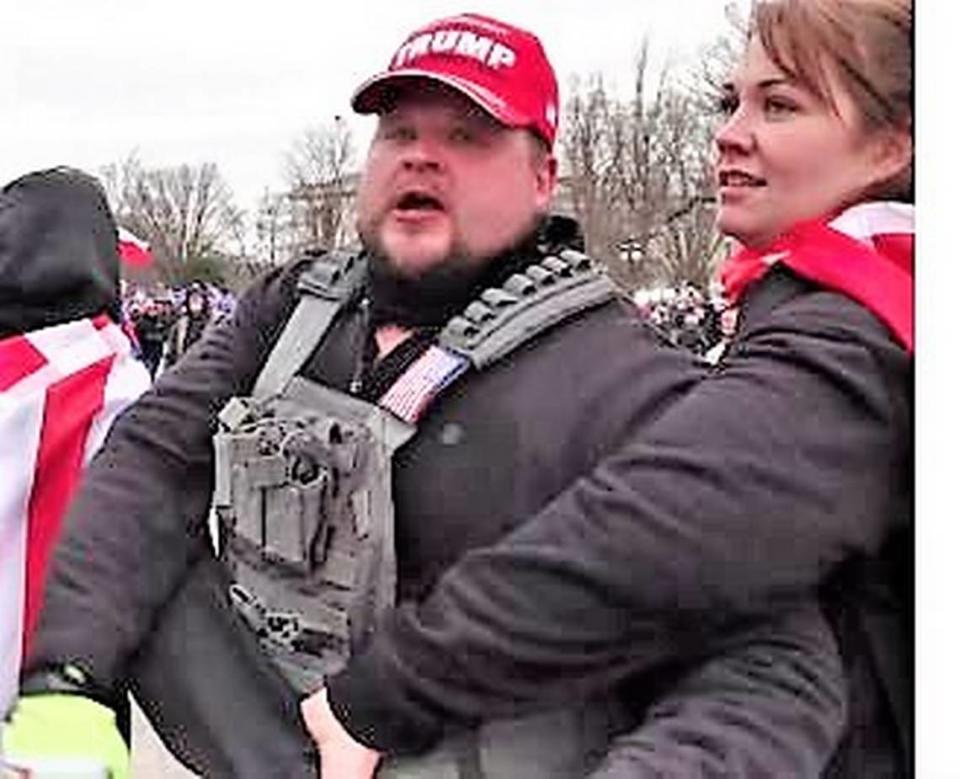 A person prosecutors say is Michael Eckerman of Wichita and an unidentified woman are shown in this photo outside the nation’s Capitol on Jan. 6. Eckerman is charged with assaulting a federal police officer and other crimes in connection with the invasion of the Capitol that day.