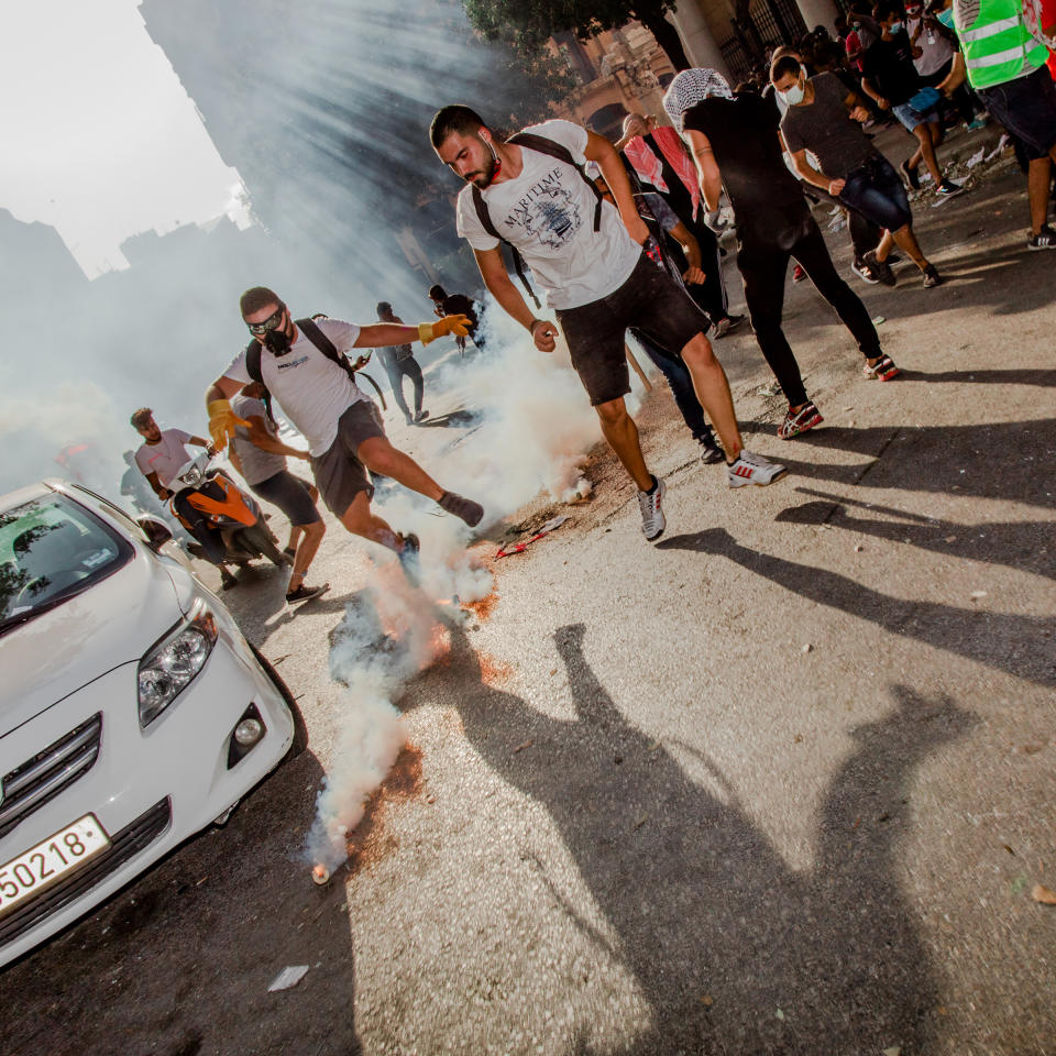 Smoke billows from a tear gas canister during an antigovernment demonstration in Beirut on Aug. 8, four days after the blast. | Myriam Boulos for TIME
