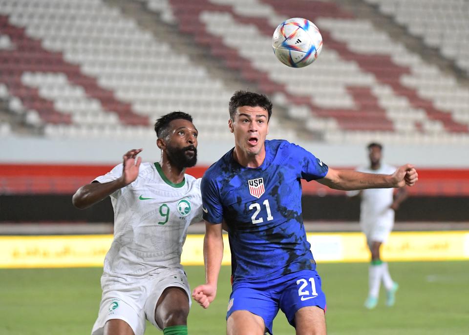 Saudi Arabia's forward Firas al-Buraikan (L) vies with US midfielder Gio Reyna during the friendly football match between Saudi Arabia and United States at the Nueva Condomina stadium in Murcia on September 27, 2022. (Photo by Jose Jordan / AFP) (Photo by JOSE JORDAN/AFP via Getty Images)