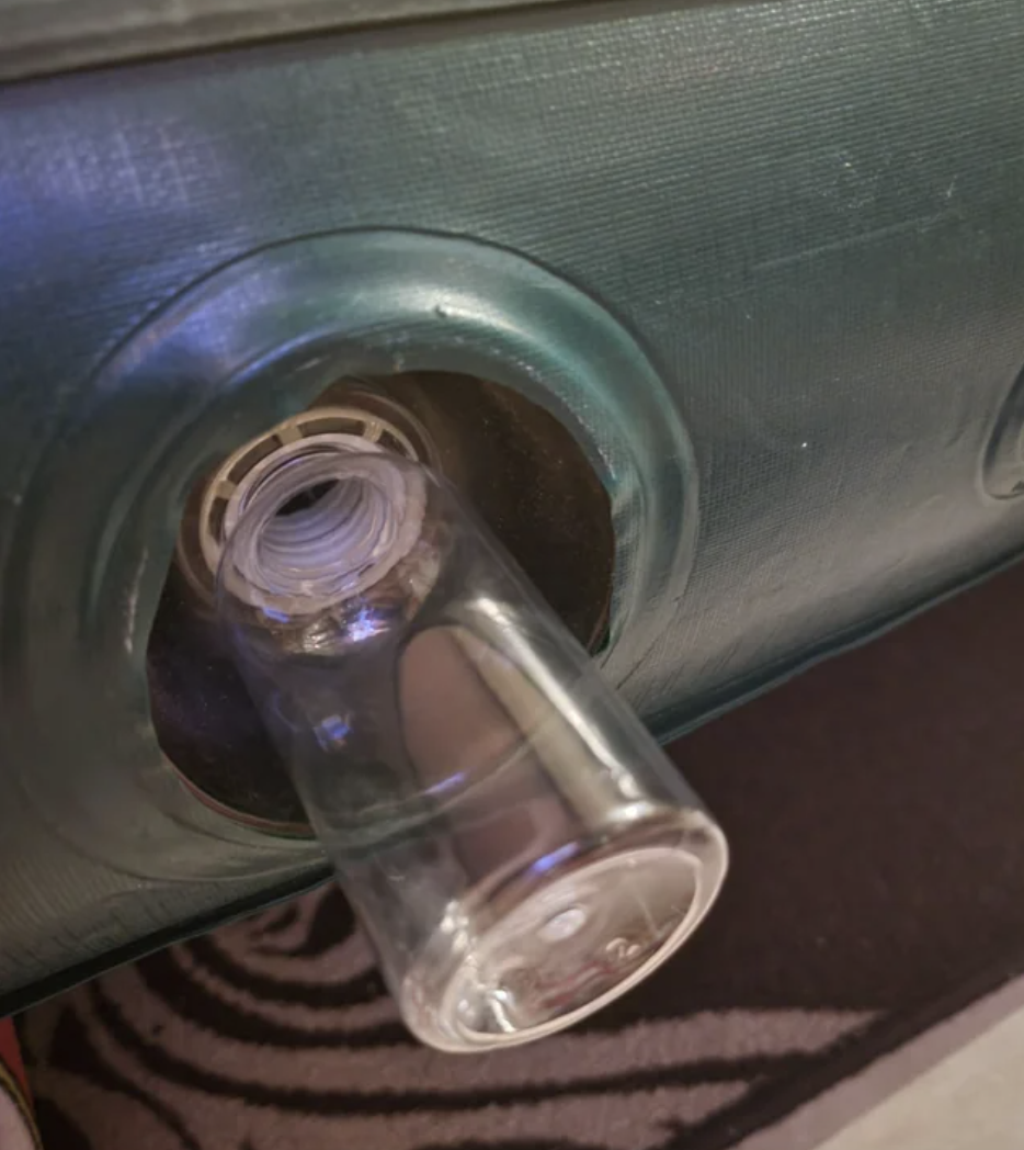 small bottle covering the air hole in the mattress