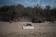 <p>A tombstone lies on a beach in the “Uppards,” part of Tangier Island, Virginia, Aug. 2, 2017. (Photo: Adrees Latif/Reuters) </p>