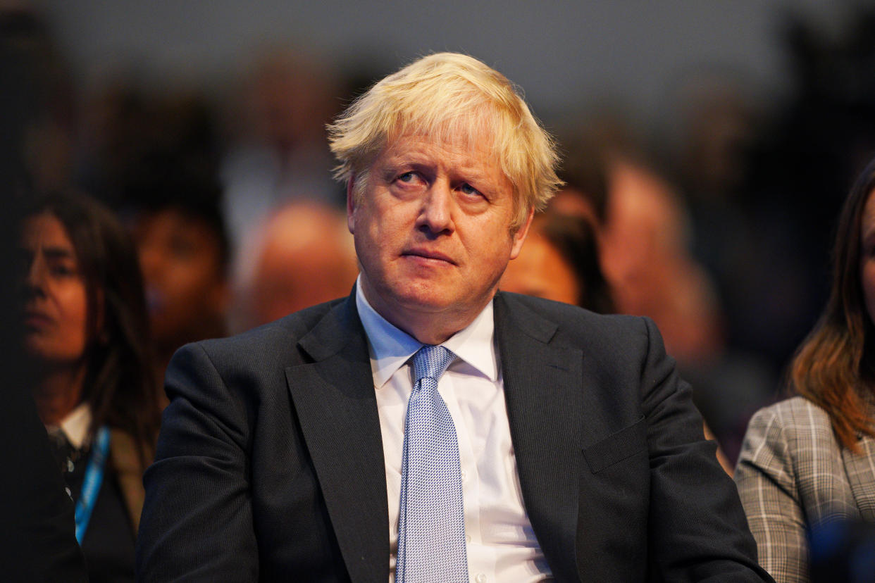 Prime Minister Boris Johnson watches on as Chancellor of the Exchequer Rishi Sunak speaks at the Conservative Party Conference in Manchester. Picture date: Monday October 4, 2021. (Photo by Peter Byrne/PA Images via Getty Images)