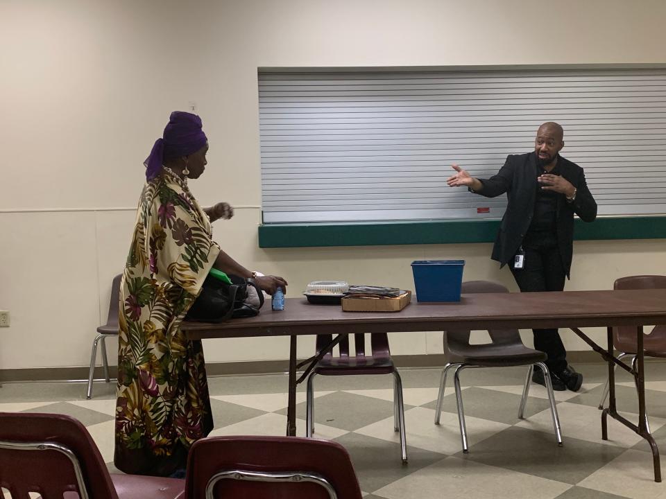 Lydia Bell, president of the Metro Gardens Neighborhood Association, and Jacksonville City Council member Rahman Johnson exchange opposing views during a meeting convened by the association about its fight against construction of a new Medical Examiner's Office building in the Brentwood neighborhood.