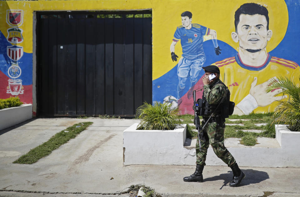 A soldier patrols Barrancas, Colombia as the city waits for the arrival of Luis Manuel Díaz to his hometown after he was released by his kidnappers, Thursday, Nov. 9, 2023. Díaz, the father of Liverpool striker Luis Díaz, was kidnapped on Oct. 28 by the guerrilla group National Liberation Army, or ELN. (AP Photo/Ivan Valencia)