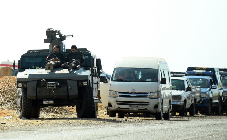 An Egyptian armoured vehicle is seen on the road to the Bahariya oasis after a deadly shootout between police and militants