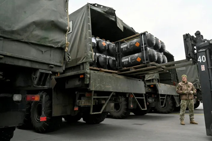 A Ukrainian serviceman loads a truck with American Javelin anti-tank missiles on Feb. 11, 2022. <a href=