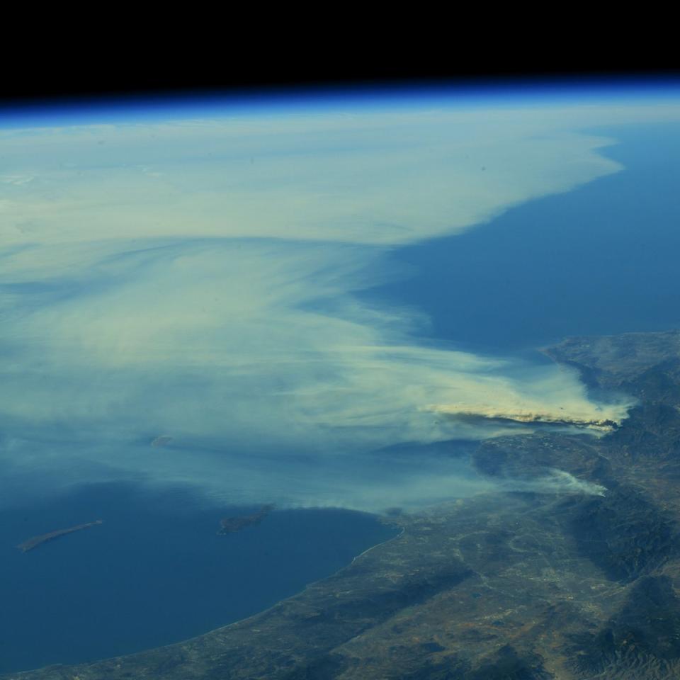 <p>A photo taken from the International Space Station and moved on social media by astronaut Randy Bresnik shows smoke rising from wildfire burning in Southern California, Dec. 6, 2017. (Photo: @AstroKomrade via Twitter) </p>