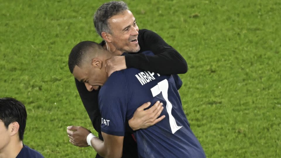 Mbappé celebrates with PSG head coach Luis Enrique after PSG defeated AC Milan in the Champions League. - Bertrand Guay/AFP/Getty Images