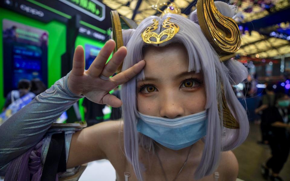 A woman in costume poses in the ChinaJoy gaming expo in Shanghai, China, in which Tencent has a huge presence - ALEX PLAVEVSKI/EPA-EFE/Shutterstock  /Shutterstock  