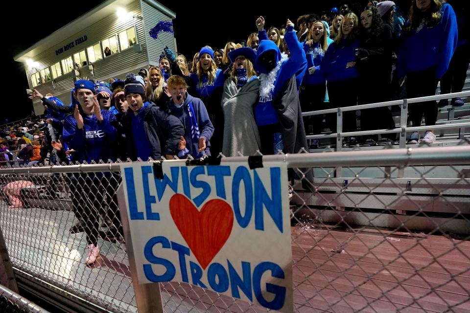 Lewiston High School students cheer during a football game against Edward Little High School, Wednesday, Nov. 1, 2023, in Lewiston, Maine. Locals seek a return to normalcy after a mass shooting on Oct. 25. (AP Photo/Matt York)