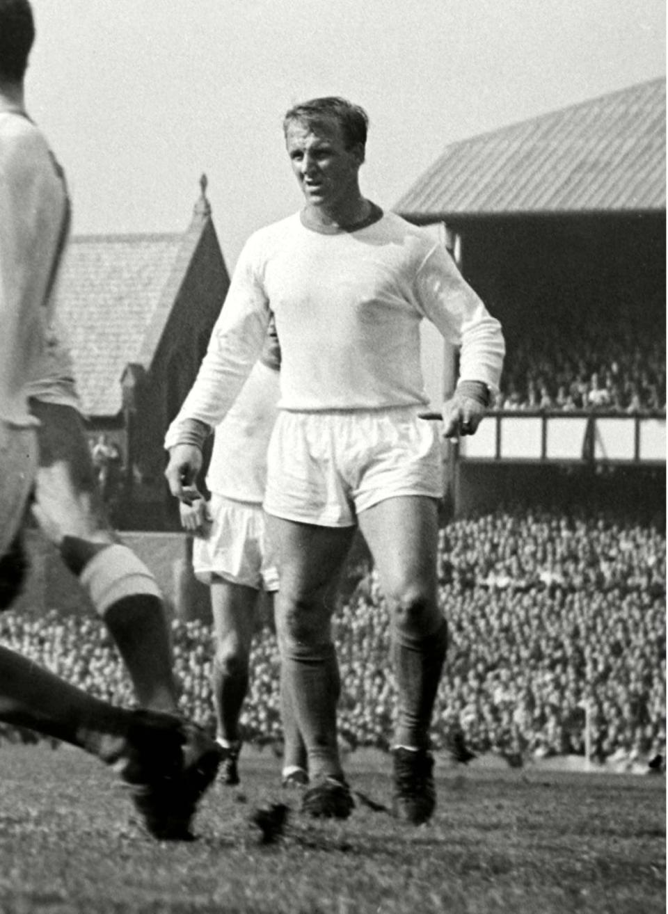 In action for Manchester United against Everton in the 1963 Charity Shield -  Colorsport/Shutterstock 