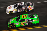 DAYTONA BEACH, FL - FEBRUARY 27: Landon Cassill, driver of the #83 Burger King Toyota, and Danica Patrick, driver of the #10 GoDaddy.com Chevrolet, race during the NASCAR Sprint Cup Series Daytona 500 at Daytona International Speedway on February 27, 2012 in Daytona Beach, Florida. (Photo by John Harrelson/Getty Images for NASCAR)