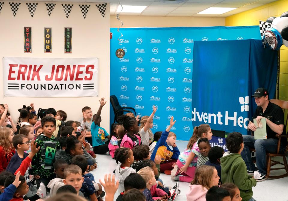 NASCAR driver Erik Jones reads to students Blue Lake Elementary School in DeLand, Thursday, Feb. 15, 2024.