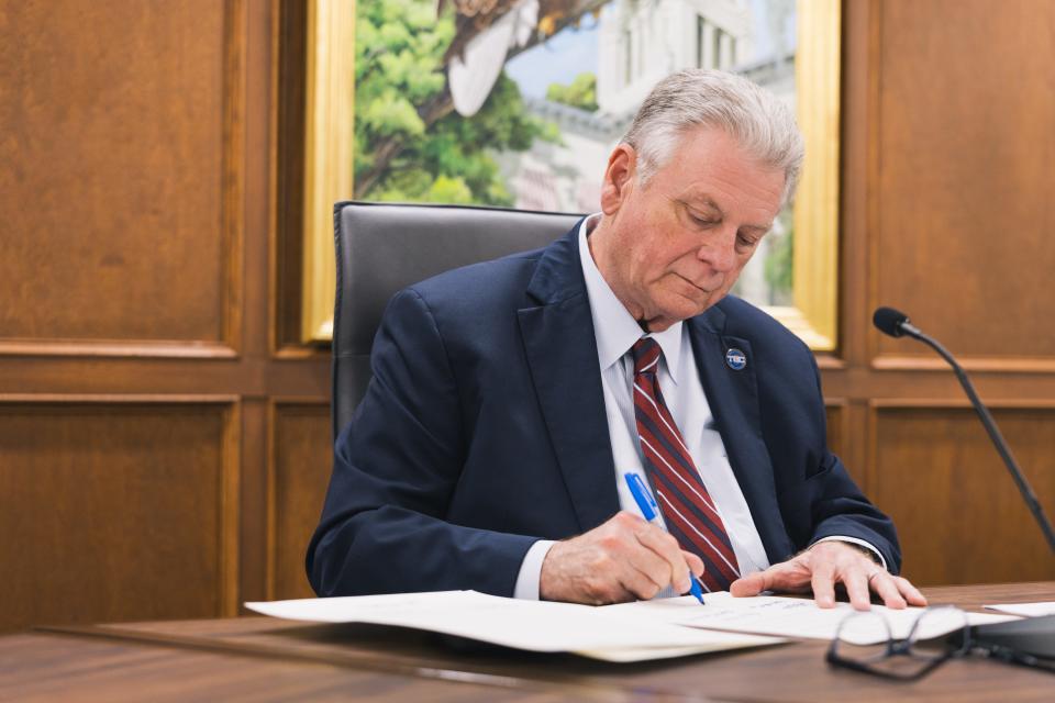 During a Board of Trustees meeting on campus, TCC President Jim Murdaugh signs a resolution on April 15, 2024 in recognition of the rebranding of the college as it will be named Tallahassee State College beginning July 1, 2024.