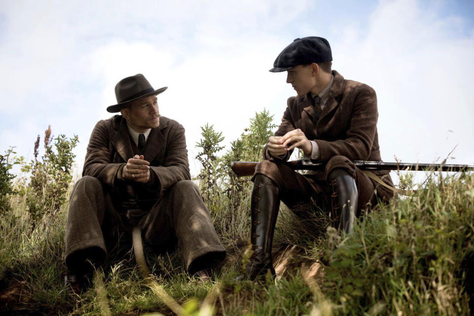 This image released by Amazon Studios/Bleecker Street Films shows Charlie Hunnam, left, and Tom Holland in a scene from "The Lost City of Z." (Amazon Studios/Bleecker Street via AP)