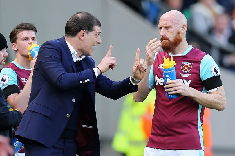 HULL, ENGLAND - APRIL 01: Slaven Bilic, Manager of West Ham United (L) speaks to James Collins of West Ham United (R) during the Premier League match between Hull City and West Ham United at KCOM Stadium on April 1, 2017 in Hull, England.  (Photo by Alex Morton/Getty Images)