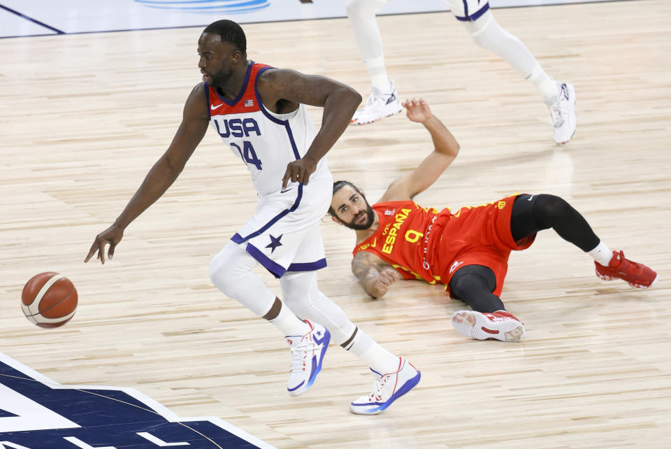 Draymond Green steals the ball from Ricky Rubio during an exhibition game ahead of the Tokyo Olympics