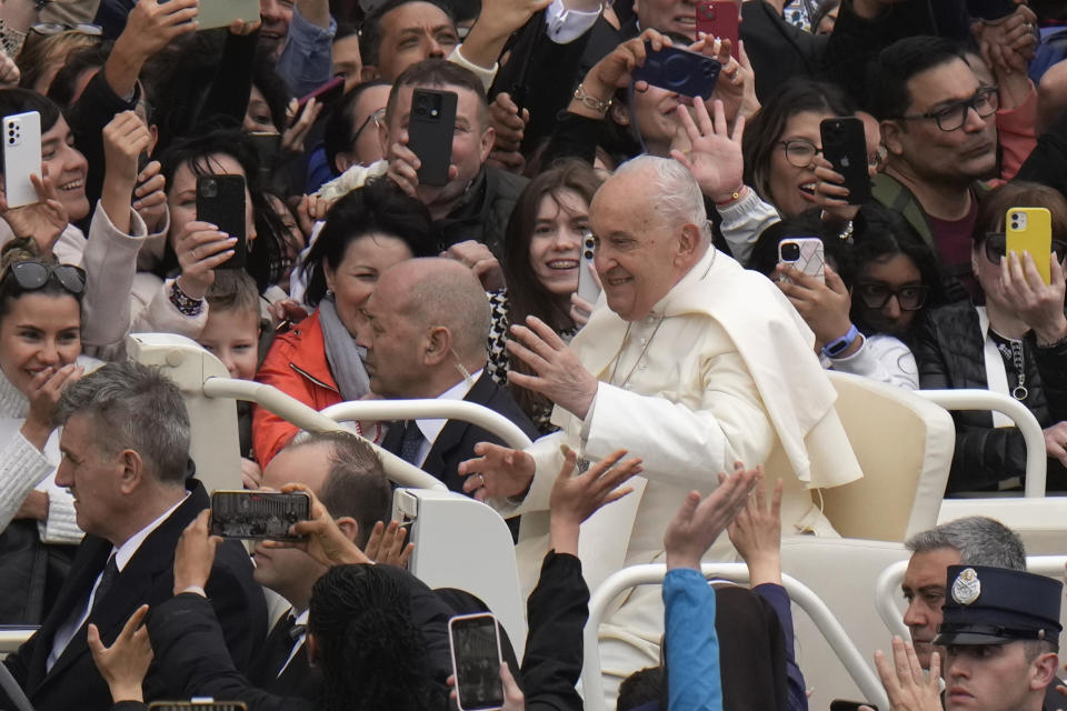 Pope Francis waves faithful after celebrating Easter mass in St. Peter's Square at the Vatican, Sunday, March 31, 2024. (AP Photo/Alessandra Tarantino)