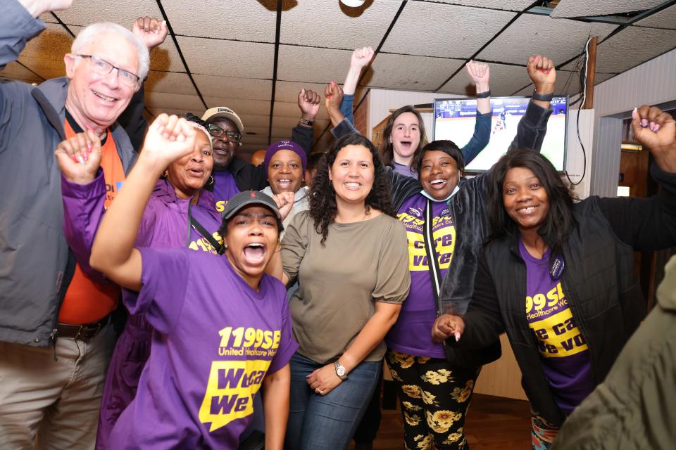 Rita Mendes celebrates at Home Cafe with members of the Service Employees International Union after securing the Democratic nomination for 11th Plymouth District state representative on Tuesday, Sept. 6, 2022.