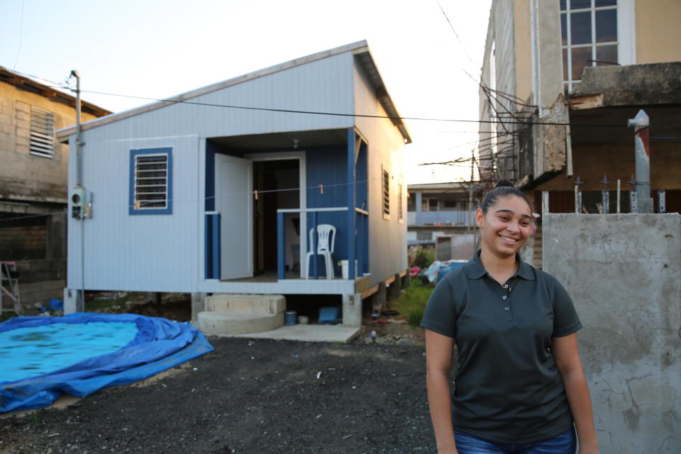 A year later, Acevedo is chipper as she talks about her new home. Built by a nonprofit organization, the house sits next door to her grandmother's now-rehabilitated home. (Photo: Carolina Moreno/HuffPost)
