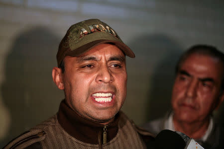 Byron Lima Oliva, former captain of the Guatemalan Army, speaks with the media after his arrest when authorities found him outside of jail when he should be in jail, in the Supreme Court of Justice in Guatemala City February 15, 2013. REUTERS/William Gularte/File Photo