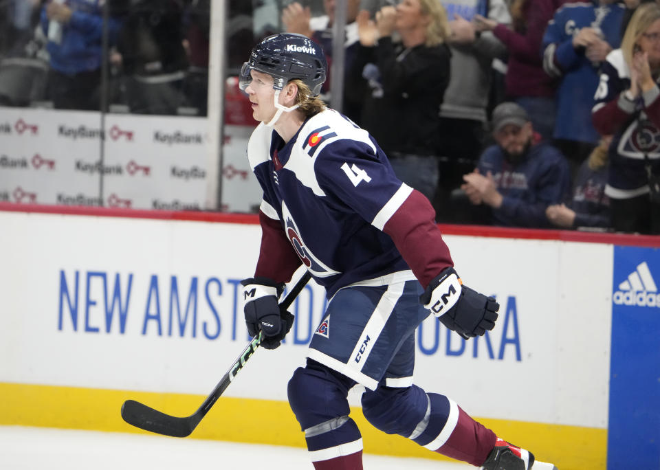 Colorado Avalanche defenseman Bowen Byram heads to the team box after scoring against the Arizona Coyotes in the first period of an NHL hockey game Saturday, Dec. 23, 2023, in Denver. (AP Photo/David Zalubowski)