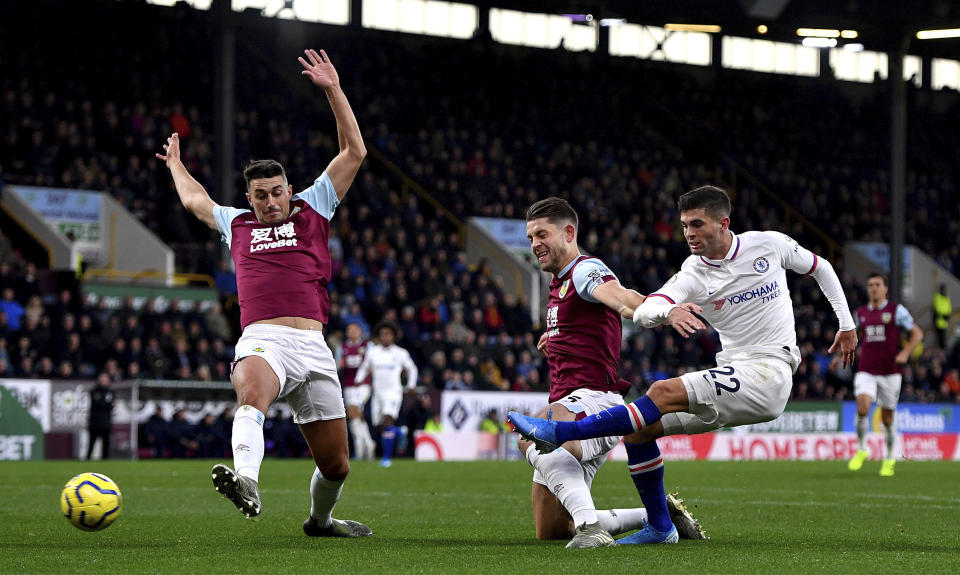 Chelsea's Christian Pulisic, right, scores his side's first goal of the game during the English Premier League soccer match at Turf Moor, Burnley, England Saturday Oct. 26, 2019. (Anthony Devlin/PA via AP)