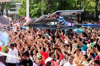 A sea of people gather to see the annual Metro Manila Film Festival Parade of Stars. (Angela Galia/NPPA Images)