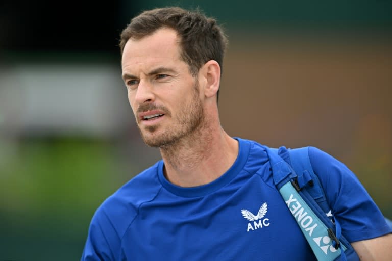 All over: Andy Murray on his way to a training session at Wimbledon (Glyn KIRK)