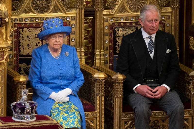 Britain's Queen Elizabeth sits next to Prince Charles during the State Opening of Parliament in central London, Britain June 21, 2017. REUTERS/Stefan Rousseau/Pool      
