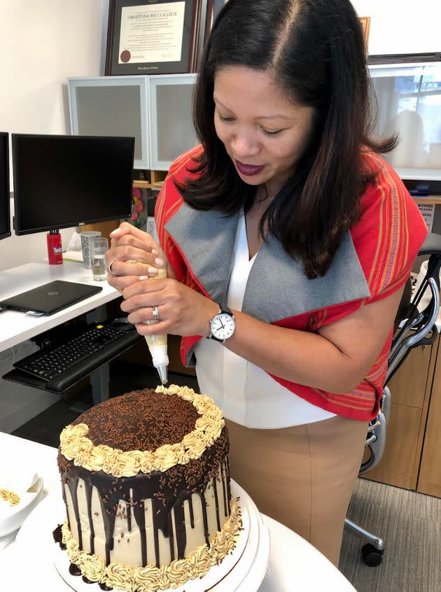 The author piping finishing touches before an office party. 