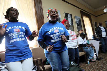 Liberian activists sing and dance prior to their Deferred Enforced Departure (DED) immigration status rally at the Minnesota State Capitol in St. Paul, Minnesota, U.S. February 22, 2019. Picture taken February 22, 2019. REUTERS/Jonathan Ernst