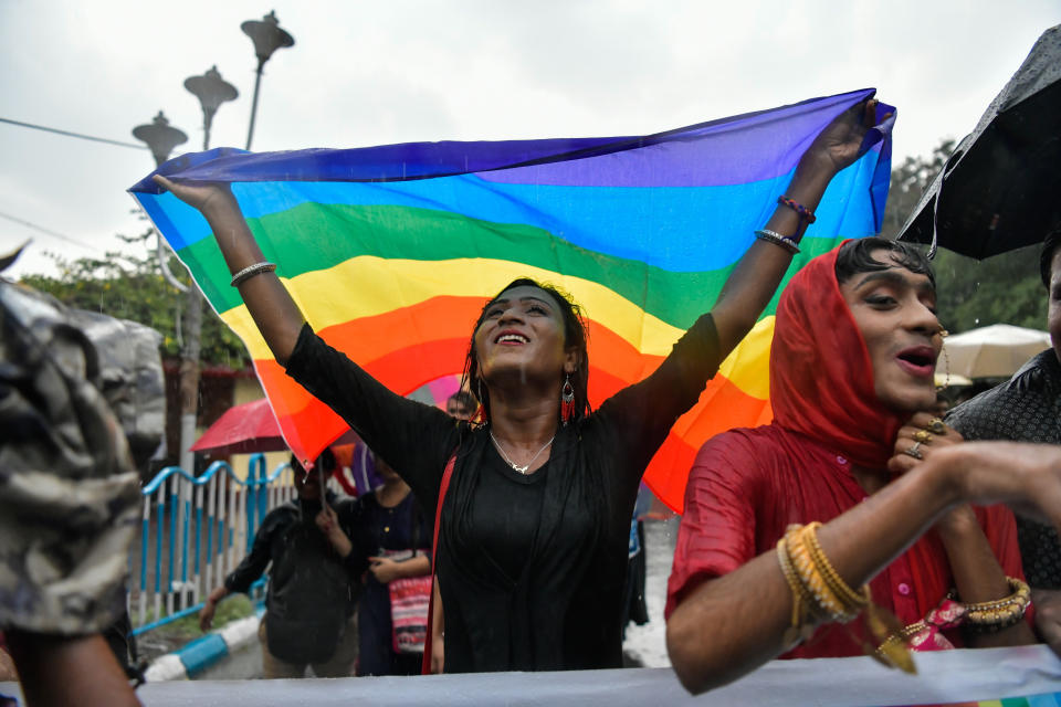 KOLKATA, WEST BENGAL, INDIA - 2019/06/29: A LGBTQ community member celebrates while holding a rainbow coloured flag as he takes part during the pride march to mark the 20th anniversary of the first Pride March in India. Twenty years ago, on July 2, 1999, Kolkata saw 15 people from different corners of India and abroad match their steps together on the streets of Kolkata and begin a new journey of visibility. The event was named Friendship Walk 99 in many ways, this was the first rainbow pride walk in India and South Asia. One key objective of the event was to remember the Stonewall Riots that took place in New York on June 29, 1969. Just as Stonewall Riots Day turned into queer pride day across the world, Friendship Walk 99 initiated rainbow pride marches in India. (Photo by Avijit Ghosh/SOPA Images/LightRocket via Getty Images)