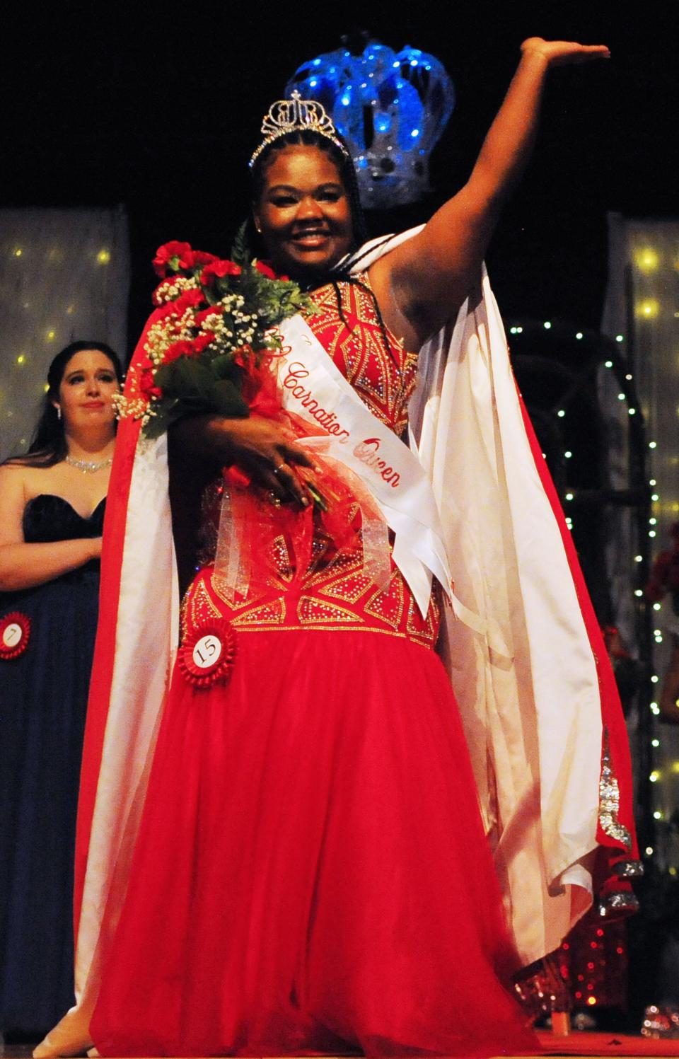 Kayla Martin waves to the crowd after being crowned as the 2022 Greater Alliance Carnation Festival queen Saturday, July 30, 2022, at Alliance High School.  She will reign over the 62nd Carnation Festival, which gets underway Aug. 4.