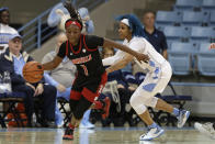 Louisville guard Dana Evans (1) dribbles while North Carolina guard Madinah Muhammad defends during the second half of an NCAA college basketball game in Chapel Hill, N.C., Sunday, Jan. 19, 2020. (AP Photo/Gerry Broome)