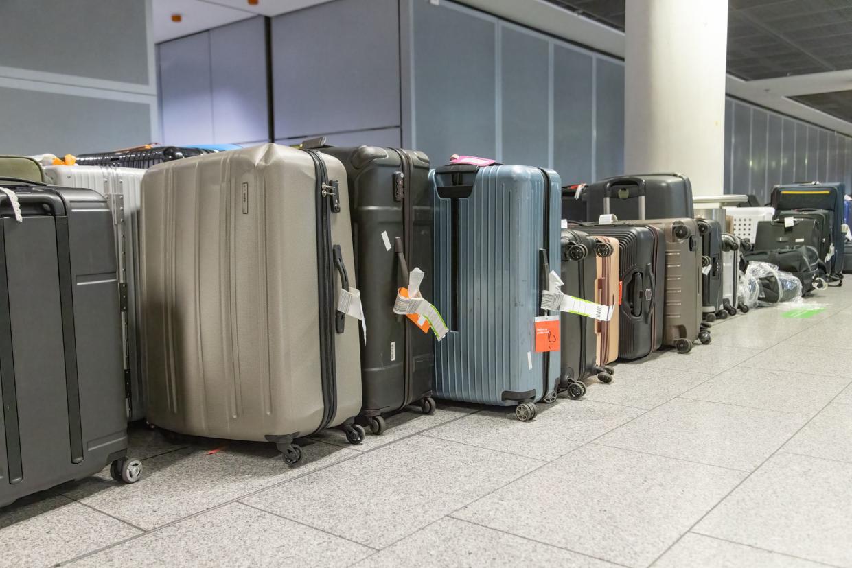 luggage chaos at airport at Night while summer Time when peope are being on vacation and need their baggage but can not find it in this mess - Frankfurt, Germany - July 04 2022