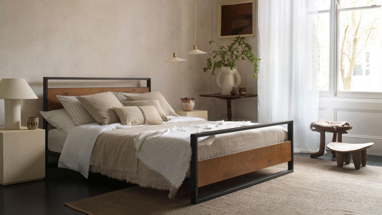  Grounding your bed lifestyle image zinus bed frame and mattress in earthy room 