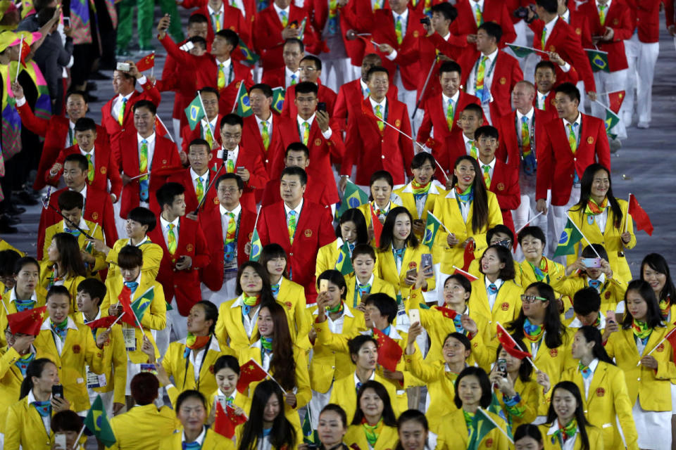 <p>China’s uniforms conjured up food products, not fashion. The garish gold jackets made the women look like eggs, and the crimson menswear turned the guys into tomatoes. </p><p><i>(Photo: Getty Images)</i><br></p>