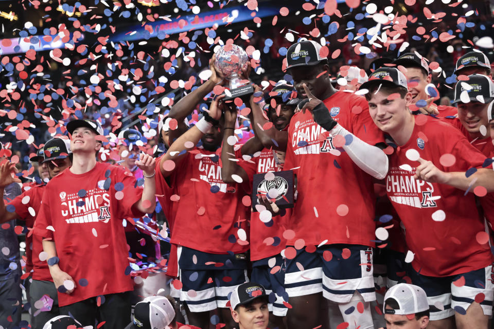 Arizona players celebrate after defeating UCLA in an NCAA college basketball game for the championship of the men's Pac-12 Tournament, Saturday, March 11, 2023, in Las Vegas. (AP Photo/Chase Stevens)