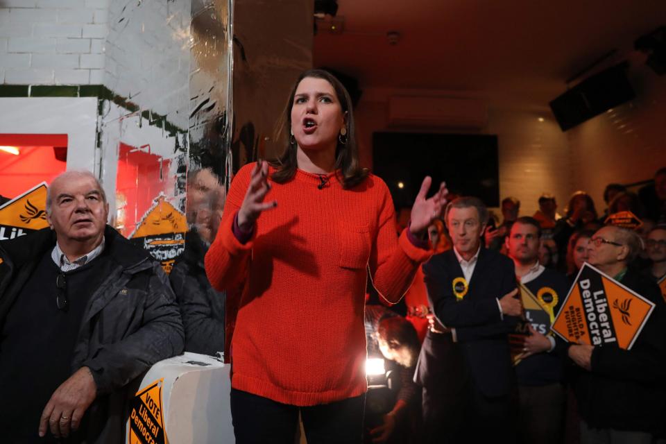 Liberal Democrat leader Jo Swinson speaks at a gathering as she canvasses on the final day of campaigning (AFP via Getty Images)