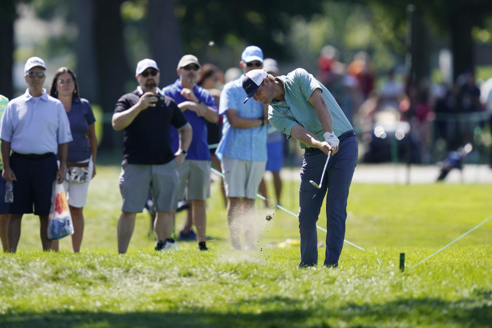 Trey Mullinax hits his second shot off the 14th fairway during the second round of the Rocket Mortgage Classic golf tournament, Friday, July 29, 2022, in Detroit. (AP Photo/Carlos Osorio)